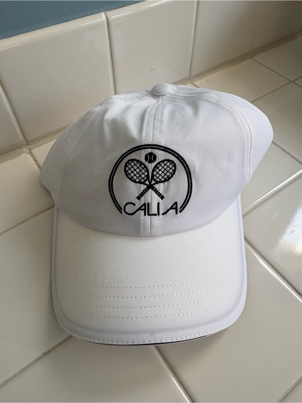 CALIA by Carrie Underwood tennis ponytail cap black embroidered racket logo